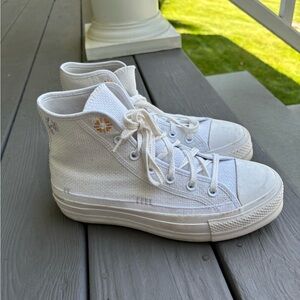 Converse Chuck Taylor All Star Platform floral high top sneakers.